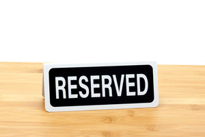 Small reserved signs for restaurants and caterings.