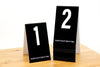 Tall black table numbers in number sequence 1-20. Our tall table numbers are ideal for any food service environment. Please place at edge of table is printed on the bottom of each number. www.citygrafx.com.
