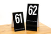 Tent style tall black table numbers in number sequence 61-80 are ideal for any restaurant or food service environment. Order online at www.citygrafx.com