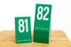 Tent style tall green table numbers in number sequence 81-100.