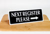 Large next register signs in black with white text are ideal for grocery and retail environments. www.citygrafx.com.