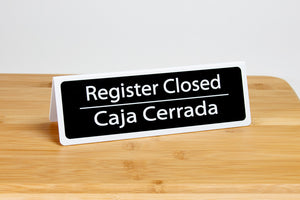 Bilingual register closed tent style signs are ideal for any retail or grocery store environment. www.citygrafx.com.