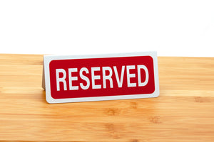 Small reserved signs for restaurants and caterings.