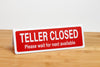 Bank teller signs feature bold white font on a red background. Teller closed signs are ideal for banks and credit unions. www.citygrafx.com